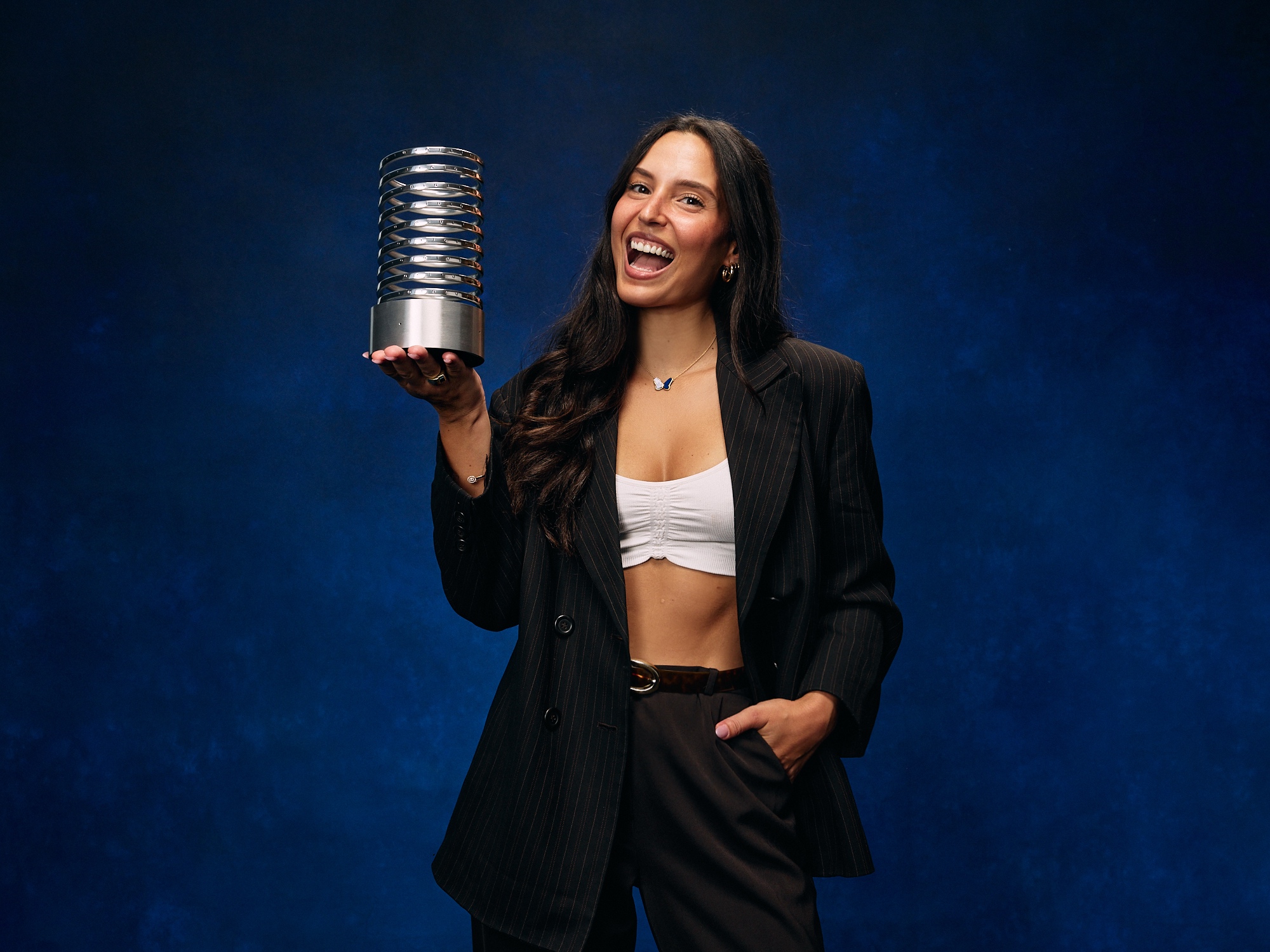 Axelle Azoulay holding a Webby Award